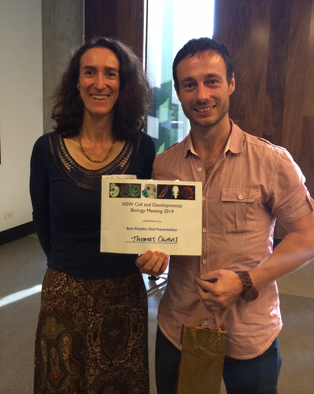 Dr Thomas Owens accepting the Post-doc speaker prize from Prof. Sally Dunwoodie (ANZSCDB, president-elect)