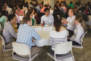 Students and invited guests talk about careers for scientists over dinner.