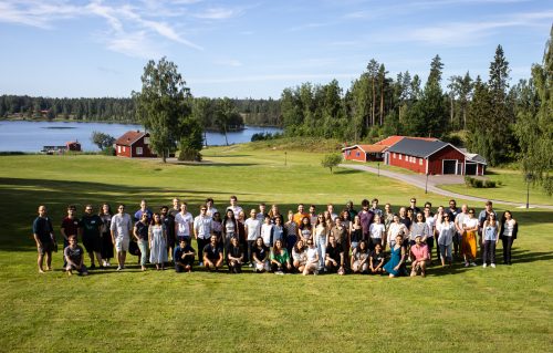 igure 1: Students, speakers, and organizers pose for a group picture.